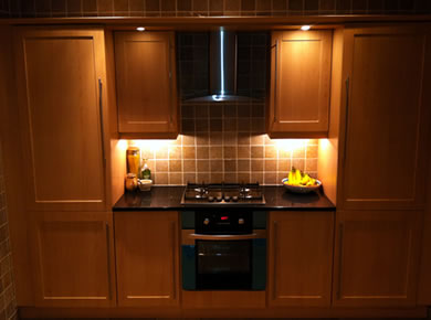 Stunning Light Oak Kitchen with Black Worktops and Tiles